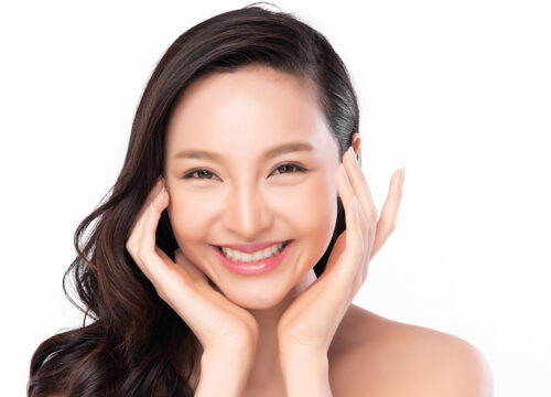 Photo of a smiling woman after dermal fillers